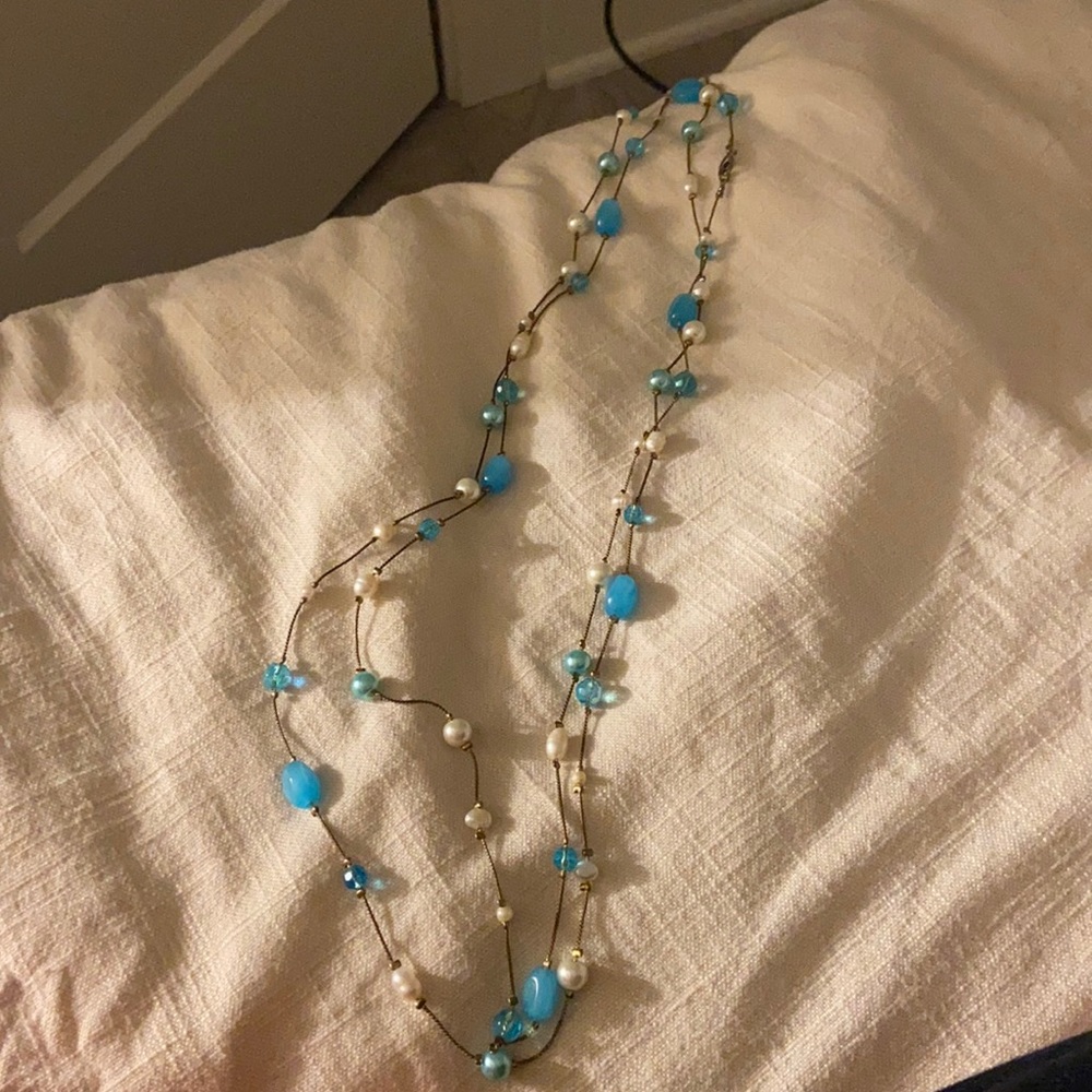 Long necklace with white and blue beads